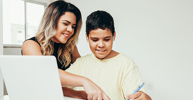 Mother and son at laptop