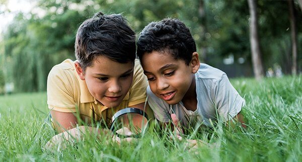 Boys exploring summer science.