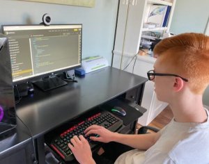 Zachary working on a coding project.