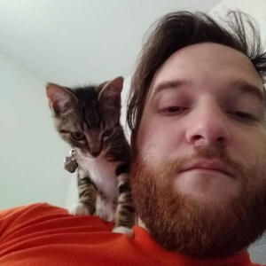 Coding teacher Tyler with cat