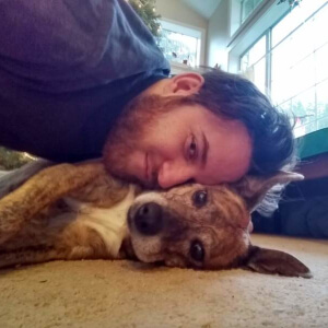 Coding teacher Tyler with dog