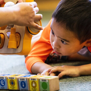 Kid playing with coding toy