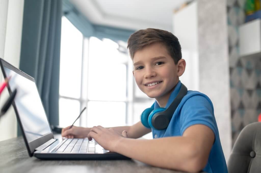Homeschooled boy learning text-based coding online