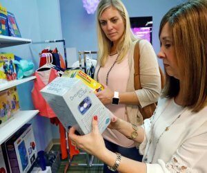 woman buying robot for kid
