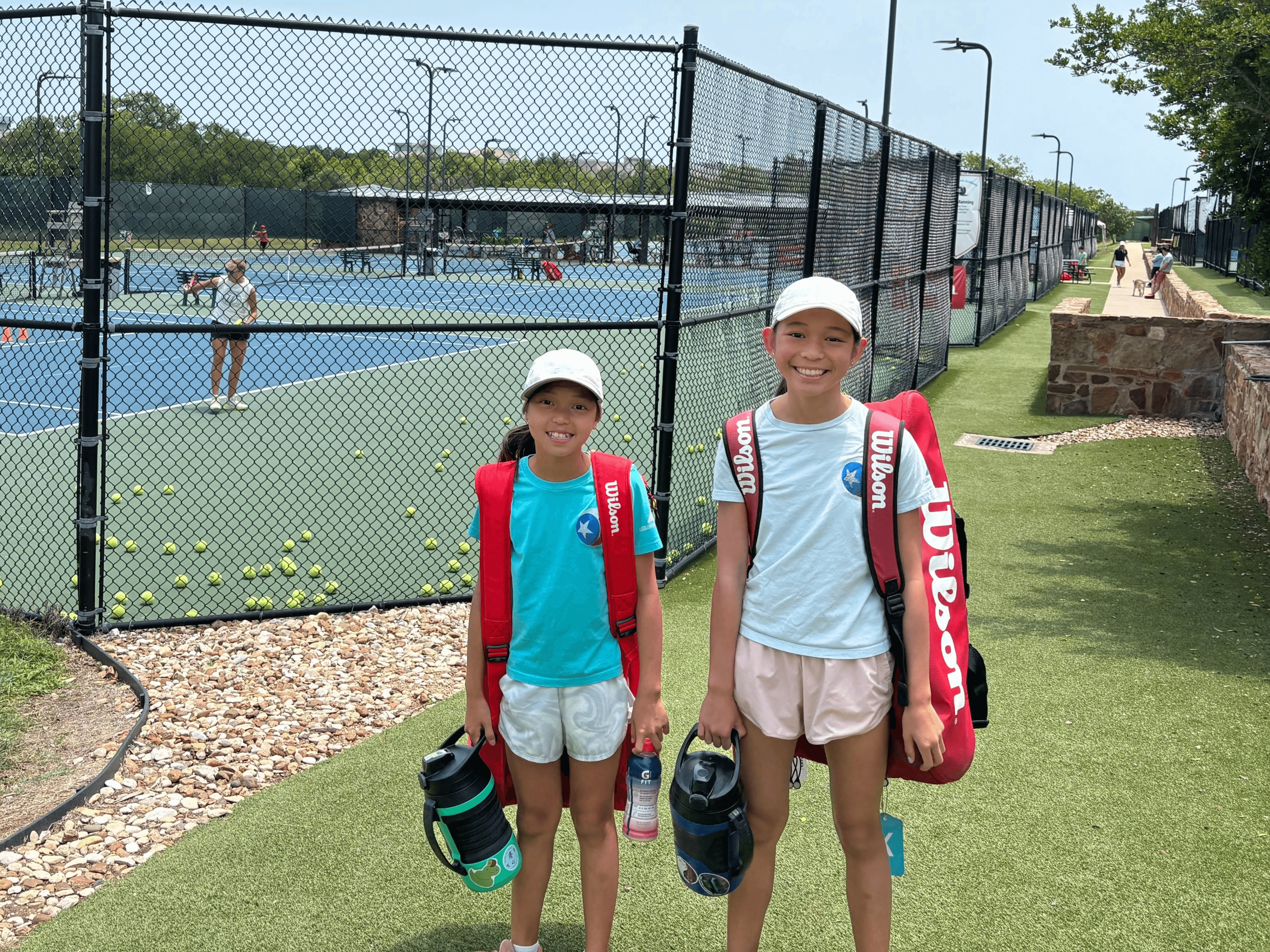 Kayla and her sister at tennis practice